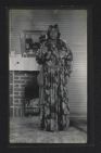 African American woman standing in front of her fireplace